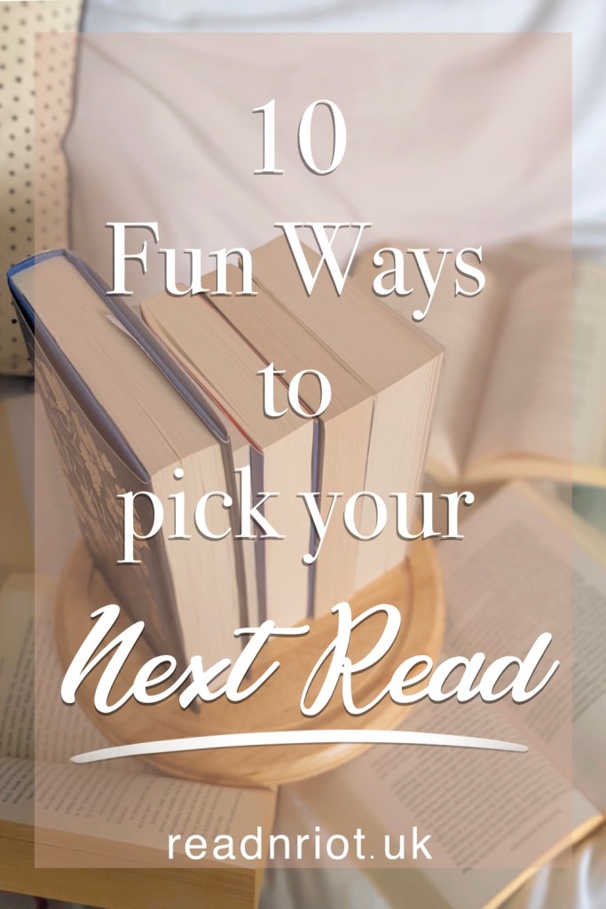10 fun ways to pick your next book to read, with books stacked and laid open flat on a bed.