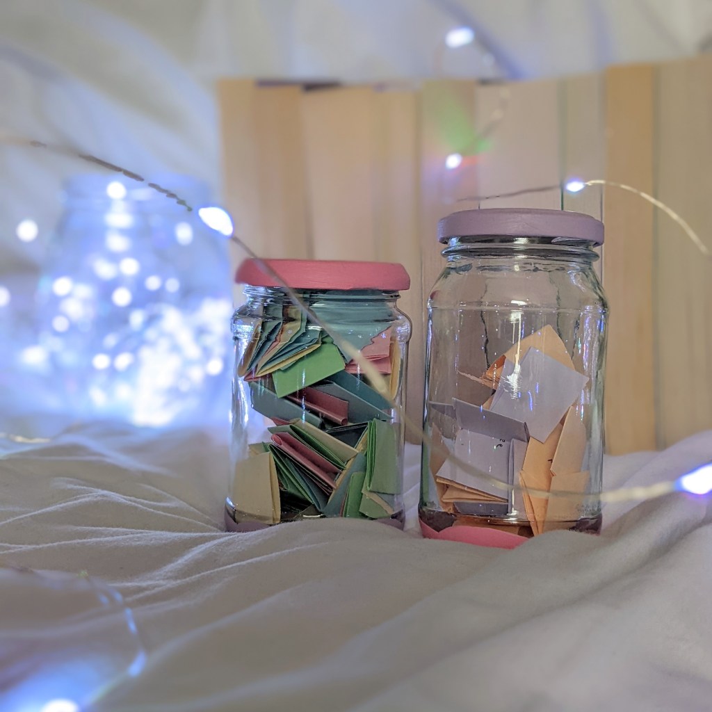 Two TBR jars containing slips of paper to help you choose your next book to read